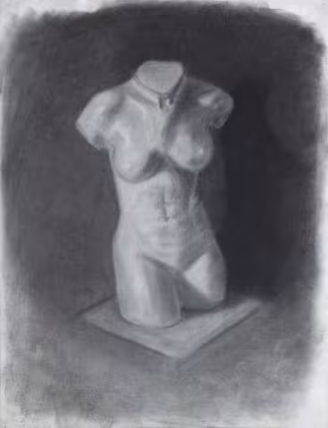A charcoal drawing of a female bust, featuring a detailed and nuanced portrait.